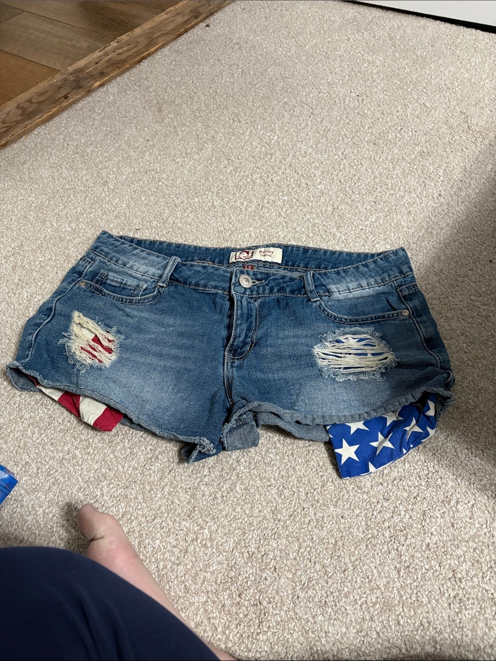 lei Blue Distressed Denim Shorts with Flag Accent